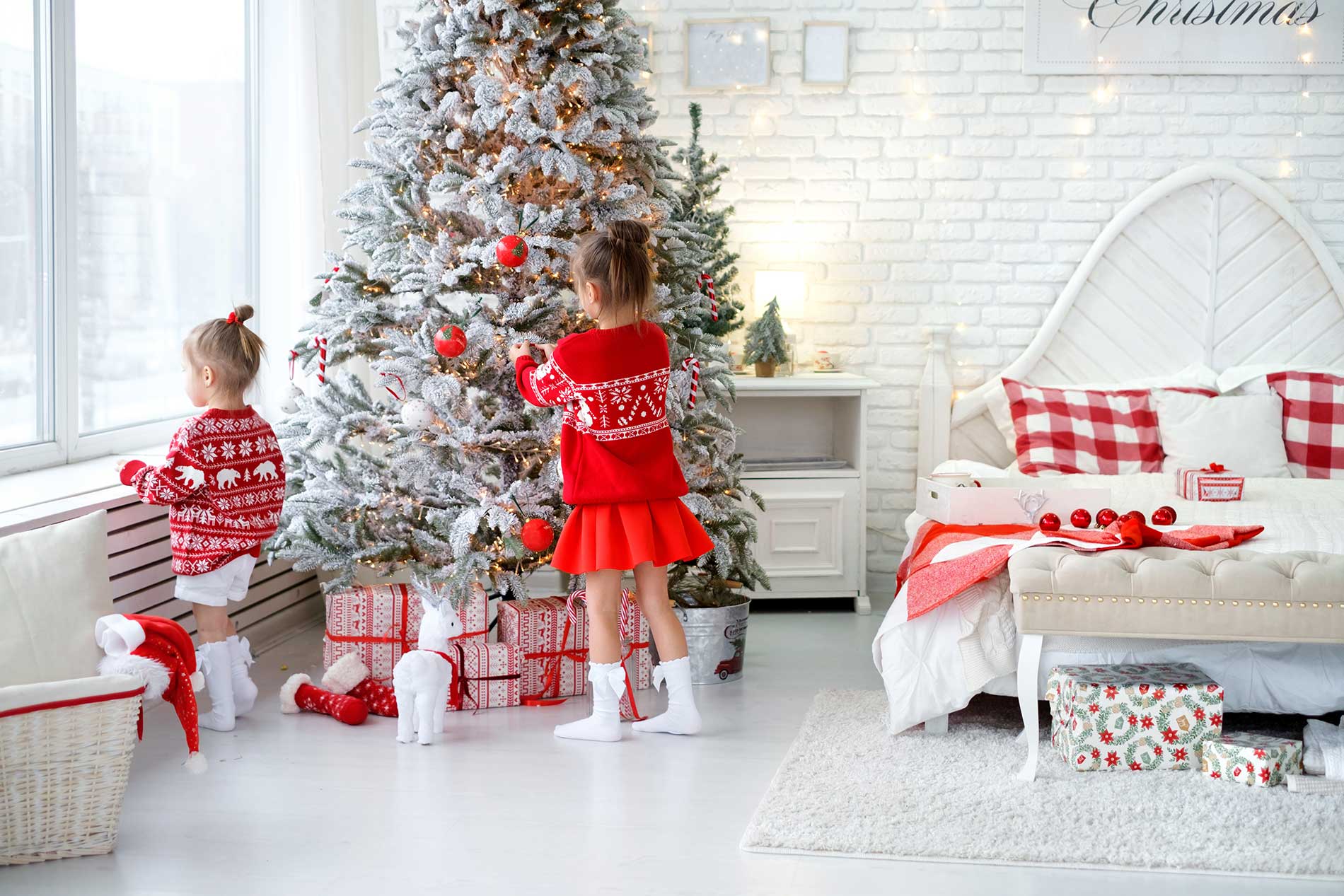 kids around the christmas tree